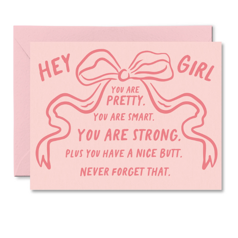Pink card with a bow design and text on a white background