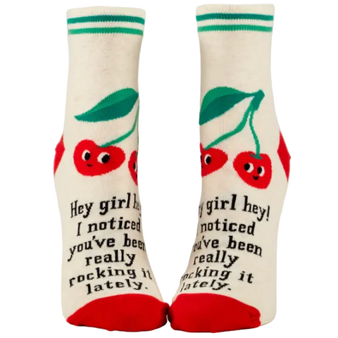 Pair of socks with cherry design and text on a website page