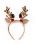 A festive reindeer antler headband featuring gold glitter antlers decorated with green pine needles, red berries, and beige faux fur ears on a white background.