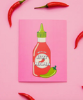 Hot Mama hot sauce bottle illustration on a pink background with red chili peppers.