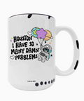 White mug with astronaut design and text 'Houston I have so many damn problems' on a white background