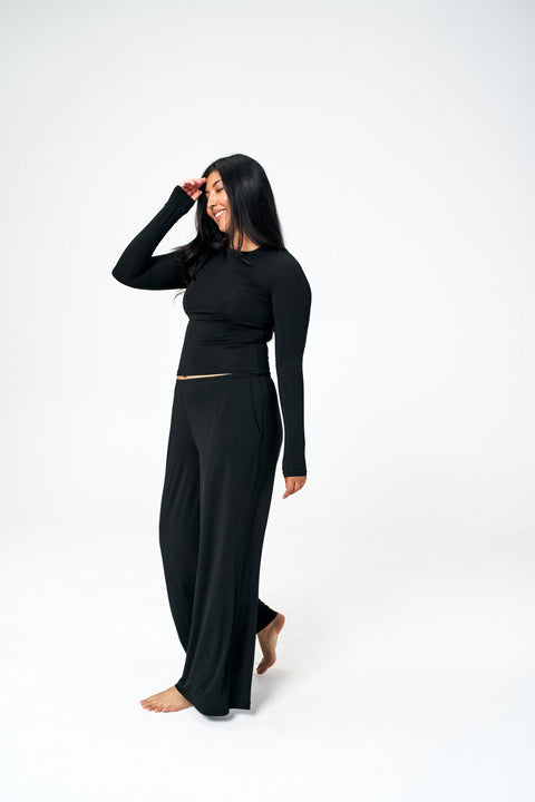 model wearing soft black loungepants