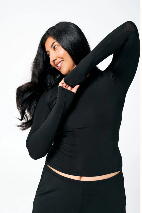 model wearing a black long sleeve huha top