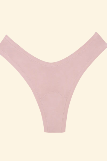 Pink thong on a beige background