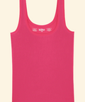 Pink tank top with 'haha' branding on a beige background