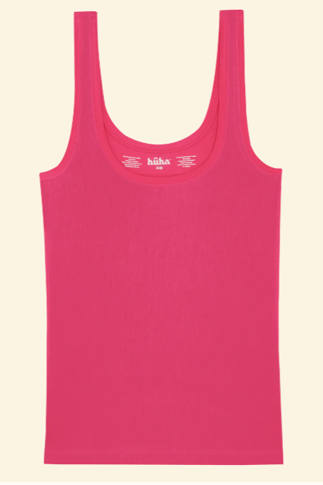 Pink tank top with 'haha' branding on a beige background