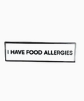 Black rectangular label with 'I HAVE FOOD ALLERGIES' text on a white background