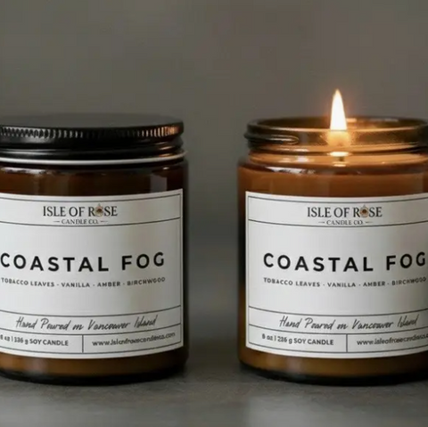 Two candles labeled 'Coastal Fog' by Isle of Rose on a gray background