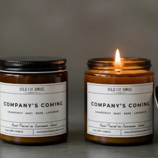 Two candles from Isle of Rose Candles with labels on a dark background