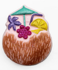 Decorative coconut with colorful elements on a white background