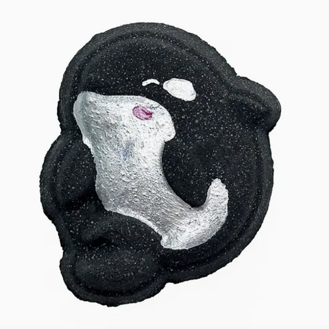 Decorative stone with a white dog design on a black background