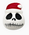 Plush toy with a skull design wearing a red Santa hat on a white background