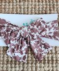 Floral patterned headband on a textured surface