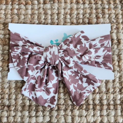 Floral patterned headband on a textured surface