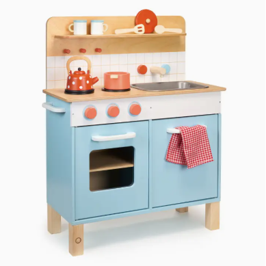 Children's wooden play kitchen with blue oven and wooden cabinets on a white background