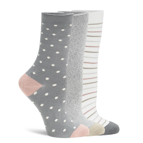 Two pairs of gray socks with white polka dots and pink and beige accents on a white background.