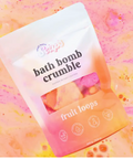 Bath bomb crumble packaging with 'fruit loops' branding on a colorful background
