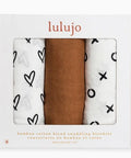 Three swaddling blankets in a 'lulujo' packaging with different patterns.