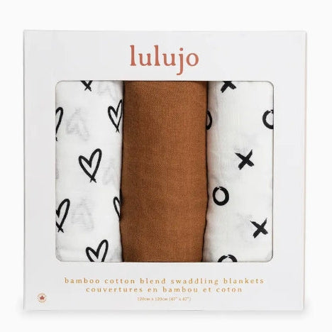 Three swaddling blankets in a 'lulujo' packaging with different patterns.
