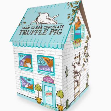 Chocolate packaging shaped like a house with 'Truffle Pig' branding on a white background