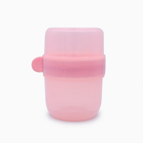 A translucent pink silicone baby bottle or feeding container with a matching pink screw-on cap and a small side tab, shown on a plain white background.