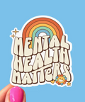 Sticker with 'Mental Health Matters' text and rainbow design on a blue background