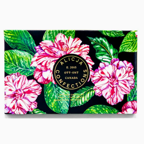 Floral design with a central circular logo on a black background