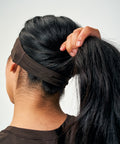 model wearing brown huha headband