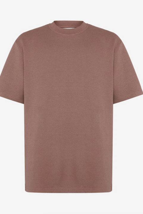 Brown patterned shirt on a light beige background