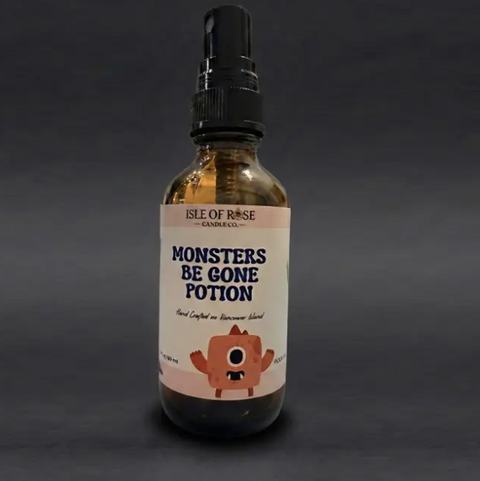 Bottle of 'Monsters Be Gone Potion' with a label on a dark background
