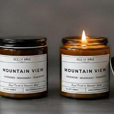 Two 'Isle of Rose' candles labeled 'Mountain View' on a gray background