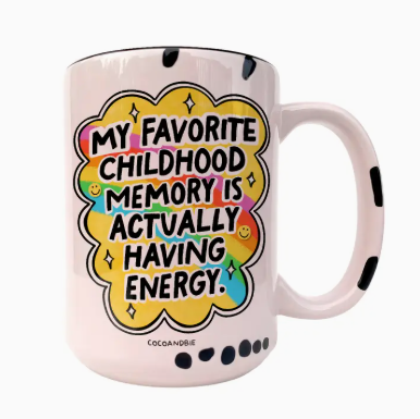 White mug with colorful text design and black handle on a white background