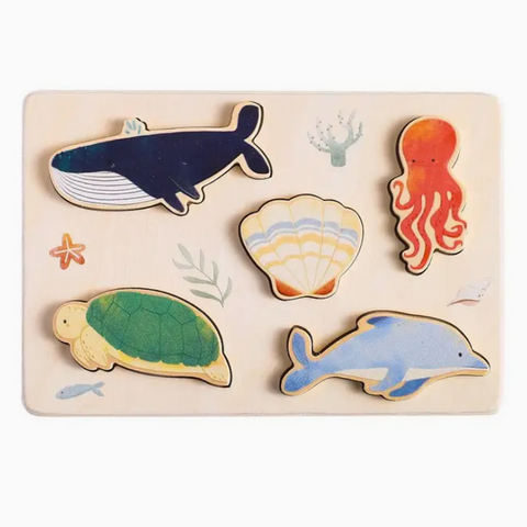 Wooden puzzle with sea-themed wooden animals on a white background