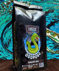 Coffin Creek Ogopogo Nanaimo Bar coffee package on a colorful abstract background