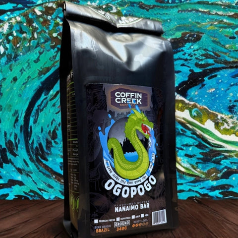 Coffin Creek Ogopogo Nanaimo Bar coffee package on a colorful abstract background