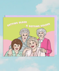 Card with illustration of three women and text 'Getting older & getting colder' on a colorful background
