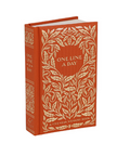 Red book with gold leaf design and 'One Line a Day' text on a white background