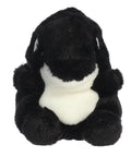 Black and white plush toy on a white background