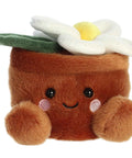 Plush toy of a brown pot with a flower on top, featuring a smiling face.