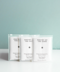 Three packages of 'Poetry of the Gods' on a light gray background