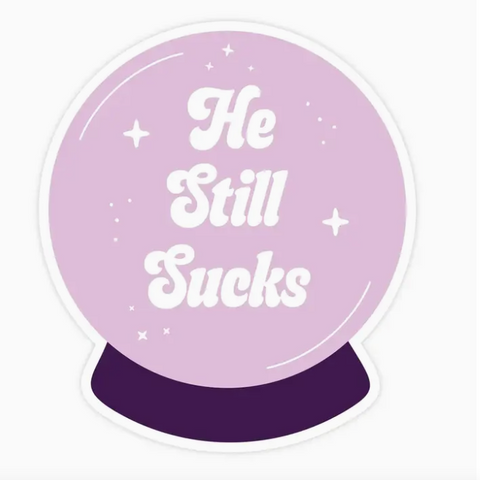 Purple crystal ball with 'He Still Sucks' text on a white background