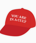 Red cap with white text 'YOU ARE IN A CULT' on a white background