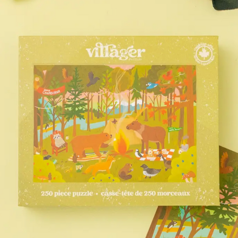 A 250-piece jigsaw puzzle box by villager Puzzles, featuring a colorful illustrated forest scene with animals around a campfire. The box is a warm yellow-green color with the brand name 'villager' at the top.