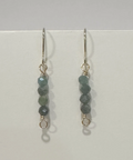 Pair of beaded earrings on a light gray background