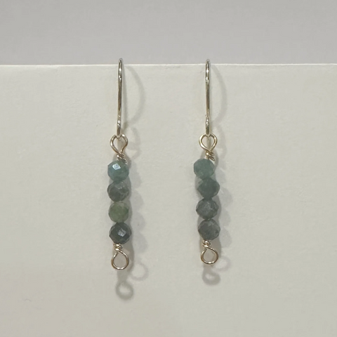 Pair of beaded earrings on a light gray background