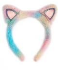 A pastel rainbow faux fur cat ear headband with pink inner ears and dark blue stitched borders, shown against a plain white background.