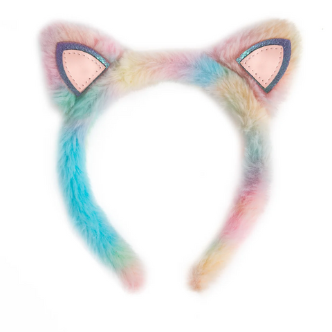 A pastel rainbow faux fur cat ear headband with pink inner ears and dark blue stitched borders, shown against a plain white background.