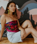 Model wearing neon pear Medium Salmon Ghost earrings from Copper Canoe Woman.