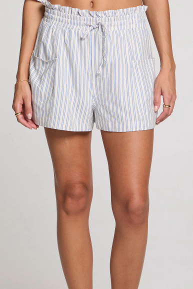Striped shorts worn by a person on a plain background