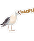Sticker of a seagull with 'SNACKS!' text on a white background